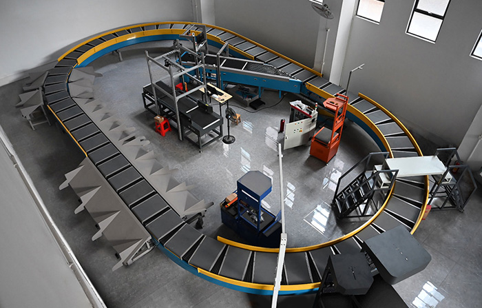 環(huán)型交叉帶分揀機的工作原理、特點及應(yīng)用